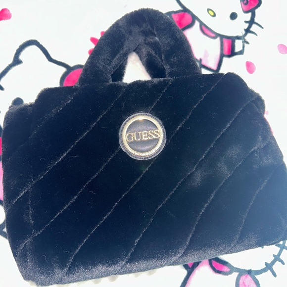 Guess Handbags - Guess black faux fur tote in good condition